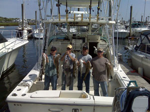 Men on Boat Holding Fish